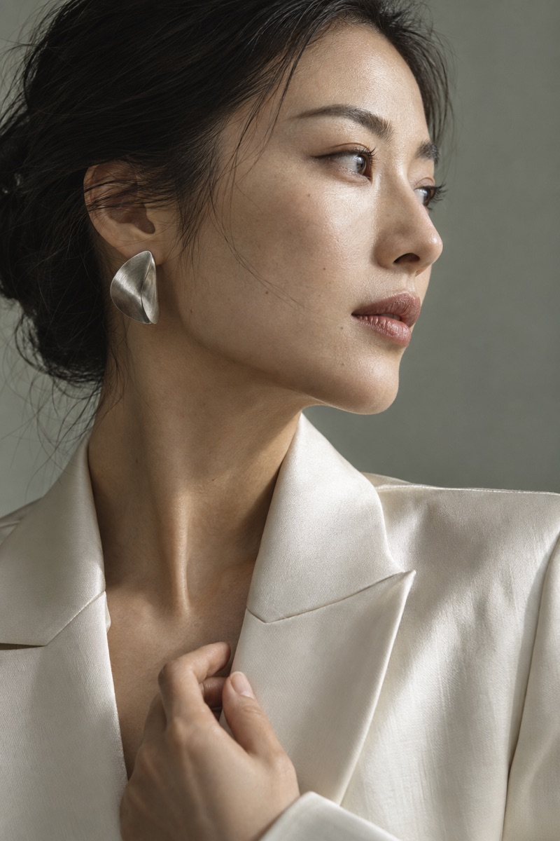 AI portrait detail study of natural skin, sculptural silver and ivory tailoring